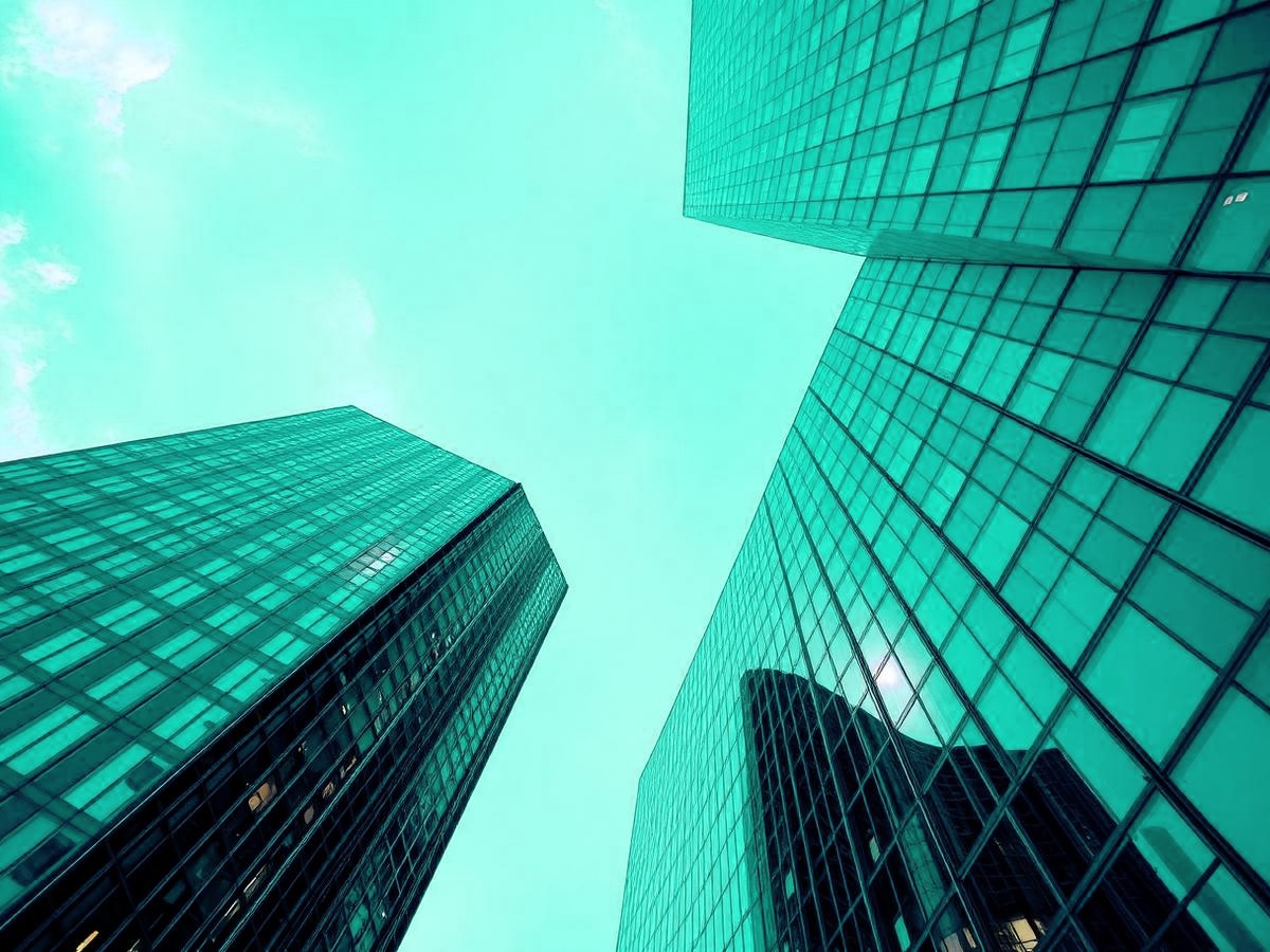 Modern glass office towers seen from below
